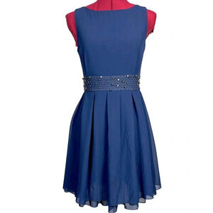 Chic Blue Sleeveless Dress with Embellished Waist